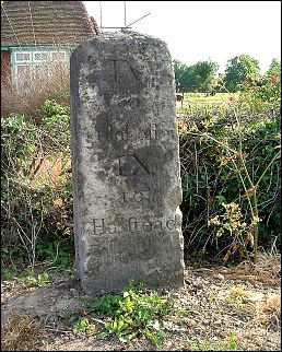 detail of Eight Ash Green milestone at TL936260