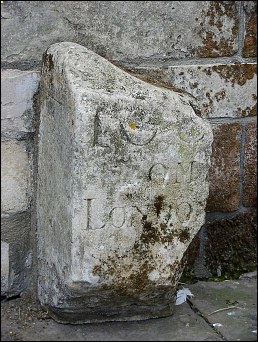 detail of St Botolph's Church milestone at TF327441